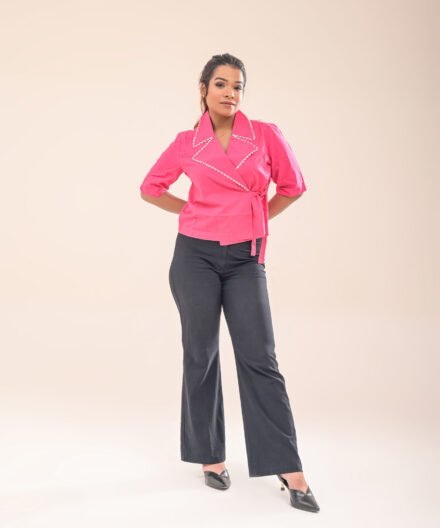 Front close-up of the asymmetric wrap shirt, highlighting the collar and fabric texture.