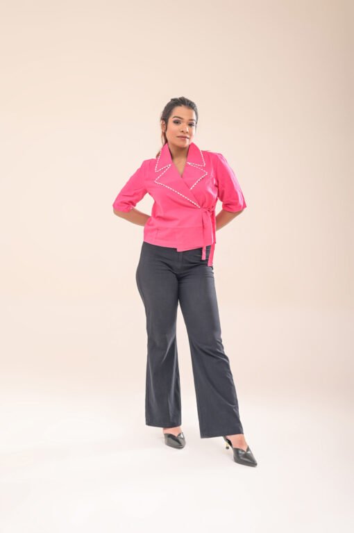 Front close-up of the asymmetric wrap shirt, highlighting the collar and fabric texture.