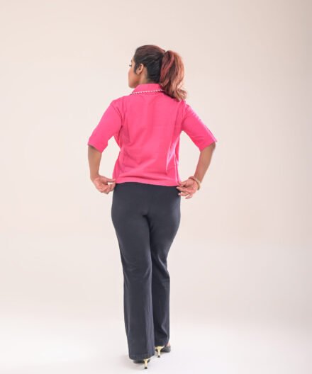 Back view of the asymmetric wrap shirt, highlighting the smooth finish and fit.