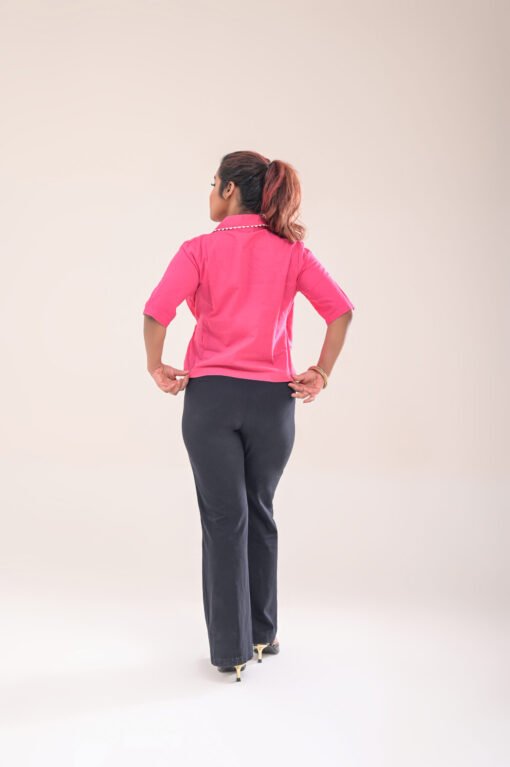 Back view of the asymmetric wrap shirt, highlighting the smooth finish and fit.